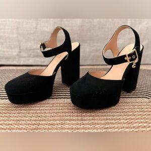 Almost-new black velvet platform high heels by Coach.